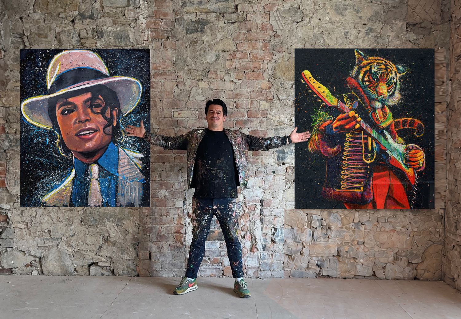 Dave Sharp standing between two of his paintings, Smooth Criminal and Tiger Hendrix